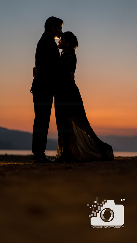 lake pre wedding shoot sunset kiss