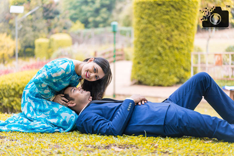 Pre Wedding Shoot Poses lying on the ground and looking camera 