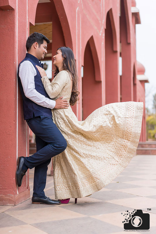 couple photoshoot pula deshpande leaning on wall